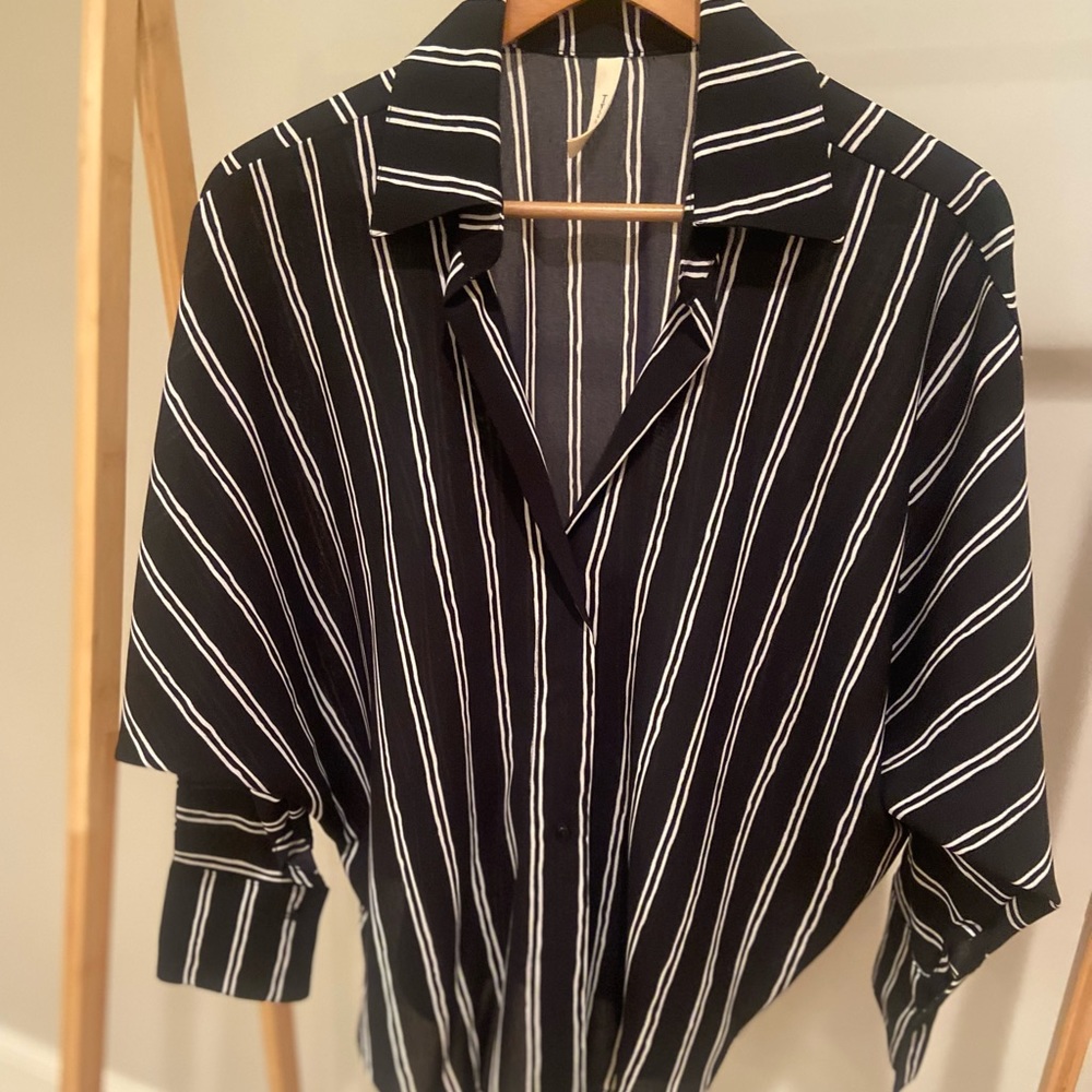 Brand new blouse with tags still on it runs very big.
